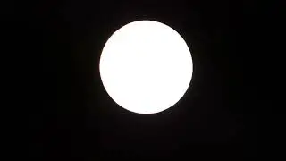 A bright Full Snow Moon shining in Nighttime for 4 minutes
