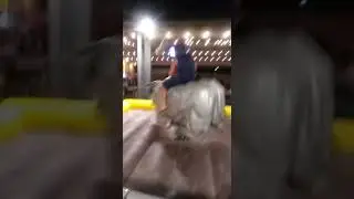 Daniel Escobedo riding the Mechanical Bull at Buffalo Chips in Cave Creek, Arizona.