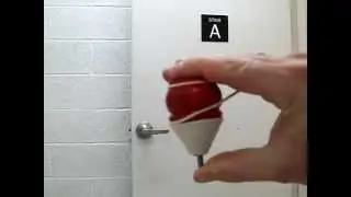 Spinning a wood top.AVI