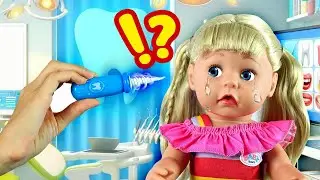The baby doll is playing on the beach and suddenly starts crying. We check to see if she's okay.