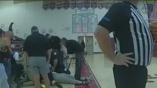 Body cam footage shows school officer save coach who collapsed at St. Cloud High School
