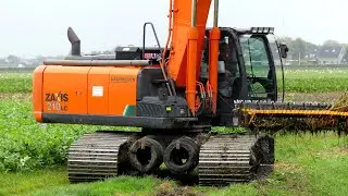 Sloten schonen met HITACHI Zaxis 210 LC Rupskraan. Mechielsen Oldenhove BV.