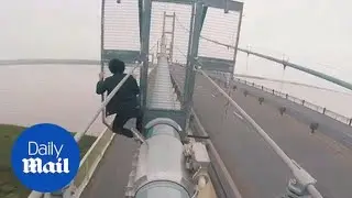 Daredevils scale 500ft-high Humber Bridge in stomach-churning video - Daily Mail