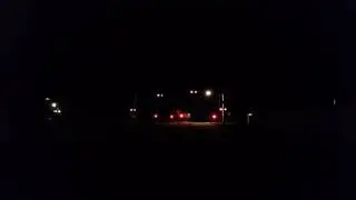 Railran night time train acceleration at crossing