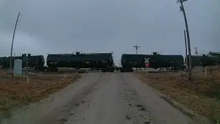 Southbound BNSF tanker train in the rain south of Elkhart, Iowa on the Spine Line
