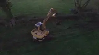 CAT 312C hedge cutting with McConnell Flail