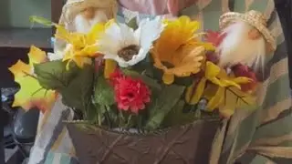 Fall floral with gnome picks in metal vase