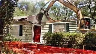 Excavator Vs. House