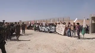 Israeli protesters block troops entering Gaza as they demand flotilla entry into enclave
