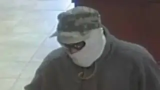 Armed -- Heavily Disguised -- Bank Robber!