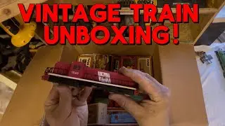 Unboxing a vintage HO scale train collection.