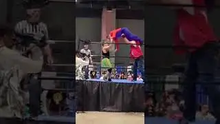 Sammy Diaz as Mario with a arm drag & head scissors combination
