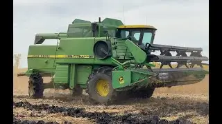 John Deere 7720 combine in mud!!