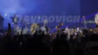 Audience recording video and taking photos at a concert with smartphones