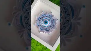 white quilling evil eye mandala