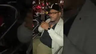 Alpo playing music for his friends in Harlem