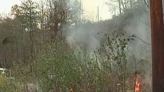 Forestry officials fight forest fire in Harlan County