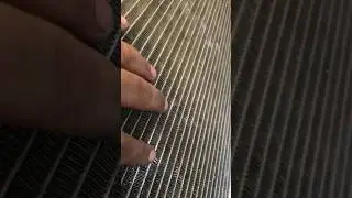A/C Not Cooling. Damaged AC Condensor. Grill Graud Damaged AC Condesor.