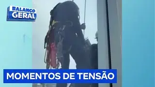 Window cleaners get trapped on building scaffolding.