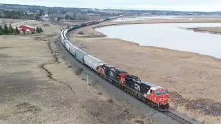 Awesome Aerial 4K View! Very Long Manifest Train CN 407 passing Upper Dorchester, NB at Track Speed