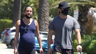 Lea Michele displays her baby bump while out for a walk with husband Zandy Reich in Santa Monica