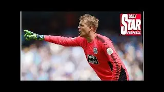 Jonas Lossl reminds Huddersfield team-mates safety is not yet secured