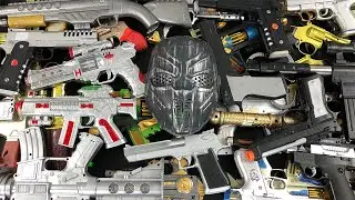 Mixed Toys Guns On The Table - BB Guns - Desert Eagle - Grenade