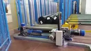 Automatic winder, wrapper and palletizer for needle punched products