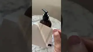 Unmounted Amber Glass Bottle Dispensers with Black Pumps.