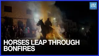 Horses leap through bonfires in Spanish village's purification festival