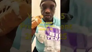 Muscle man tries Big Texas cinnamon roll.
