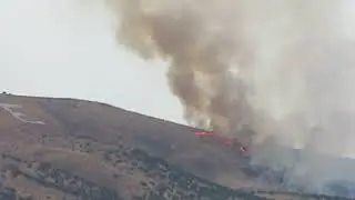 Fire moves up Elko Mountain toward Spring Creek