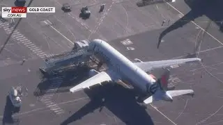 Flight from Sydney touches down on Queensland's Gold Coast amid border reopening