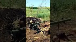 Ukrainian combatants using a SPG-9 'Spear' tripod-mounted 73mm recoilless gun