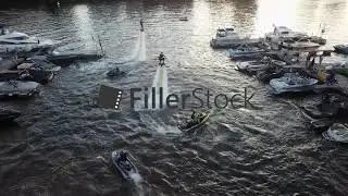 Water jet flyboard riders performing for people, aerial