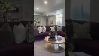 Purple couch, daylight basement and high ceilings!