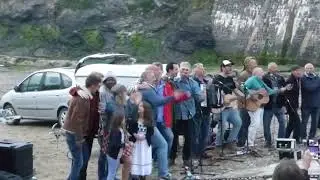 Fisherman's Friends and some of the film cast singing Drunken Sailor