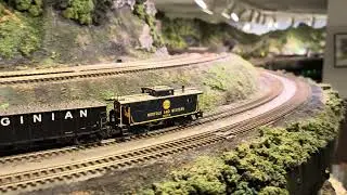 PRR Q2 and medium coal train climb the grade at John K's HO layout.