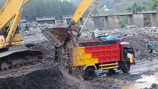 heavy equipment operators who work in sand mining in Indonesia