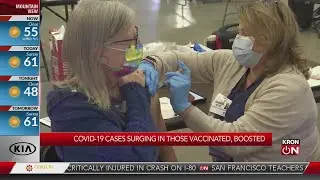 COVID-19 cases surging in those vaccinated, boosted