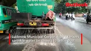 Lucknow Municipal Corporation's tankers sprinkle water on streets to settle dust