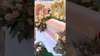 Baby funeral with sisters saying goodbye by loving on the baby one final time by touching the casket