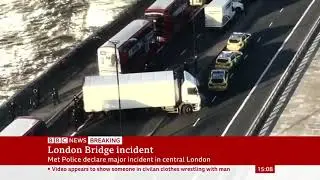 After the incident in central London, a lorry straddling London Bridge is examined by armed police