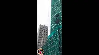 A BACKHOE LOADER carrying a heavy materials for new Buildings business HONGKONG