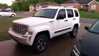 Jeep Liberty wheel spacers complementing the Rough Country lift.