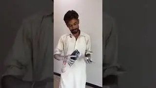 pakistan local singer paint wala.  (white Wash man signing)