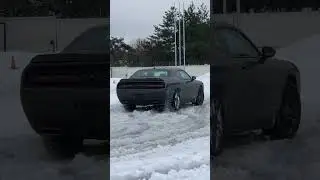 Dodge Challenger GT AWD. Wetsliding close up 2/3