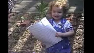 1990 April 1 Preston reading in side yard