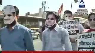 Youth wing related to BJP conducts protest march wearing masks of political leaders