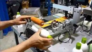 Semi-automatic labeller for cylindrical products